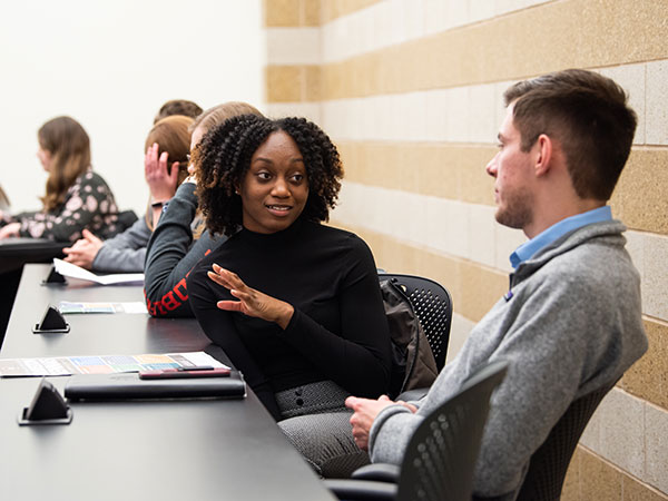 Students in a conference room.