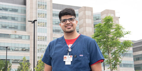 A man wearing scrubs.